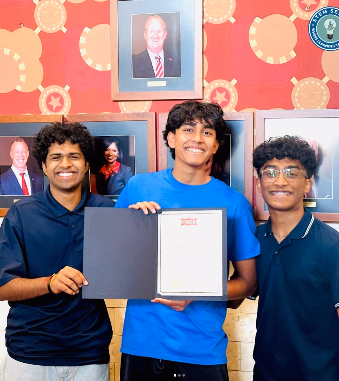 Three STEMSeeds members holding the City of Frisco Certificate of Recognition