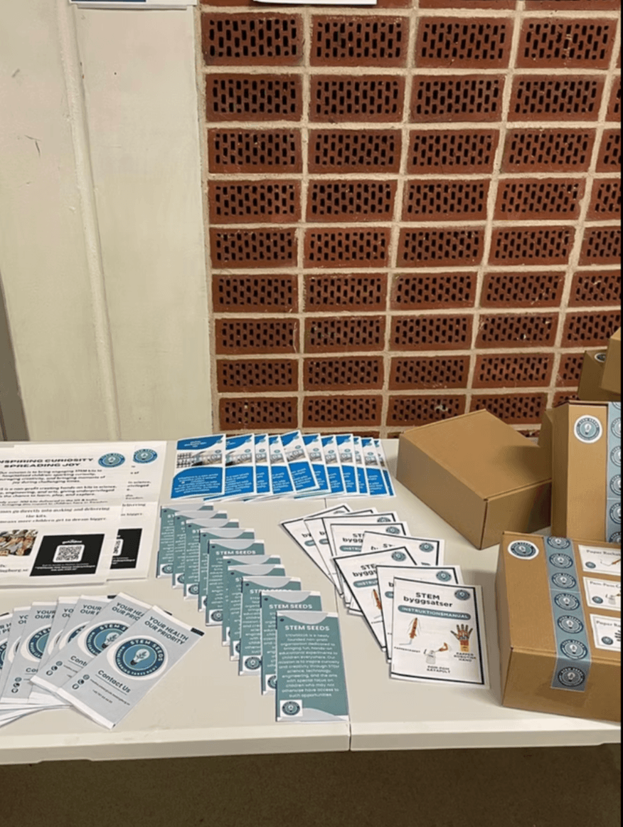 A chapter table in Sweden with STEM byggsatser instruction manuals, brochures, and kit boxes